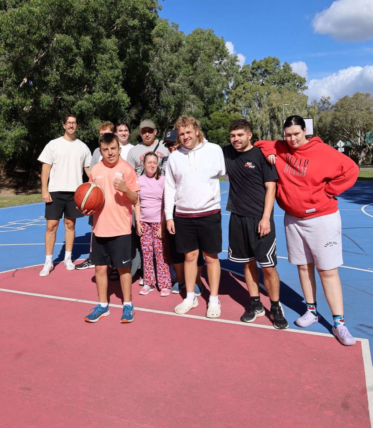 A Support Mates squad together on the basketball court